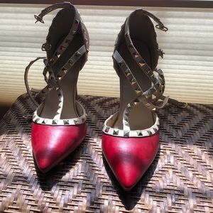 Red heels with gold studs; size 10